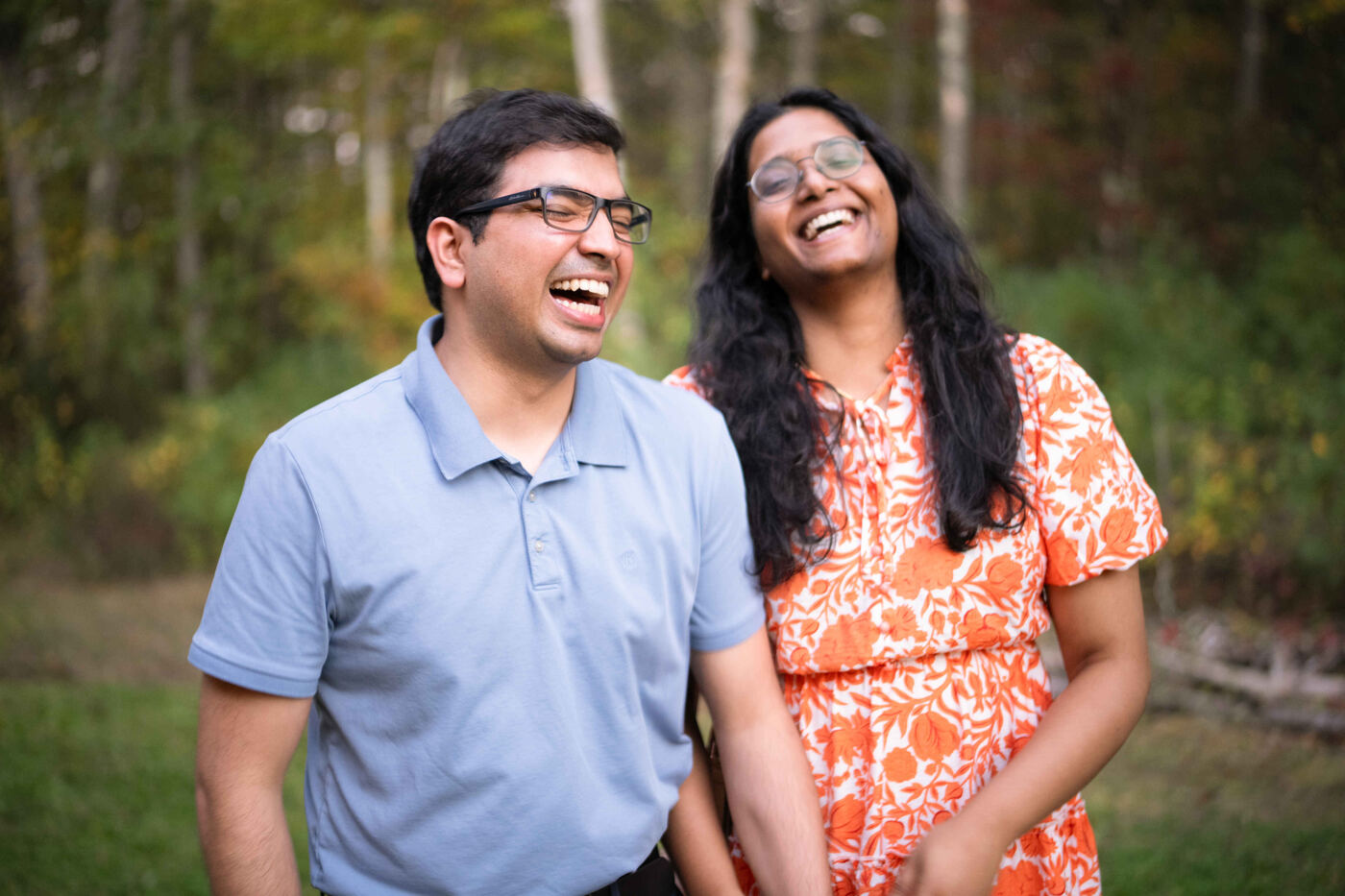 A couple laughing outdoors